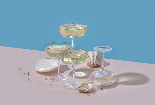 Iridescent coupe glasses with shells and pearls