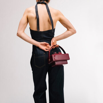 Back View Of Denim Halter Dress With Purse