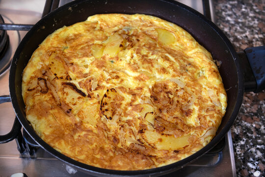 Homemade potato omelette in pan