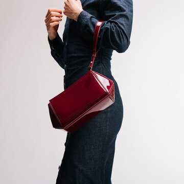 Red Handbag On Denim Outfit