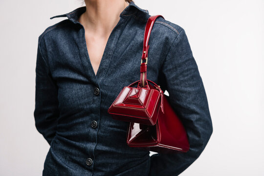 Red Leather Handbag Styled With Denim Jacket