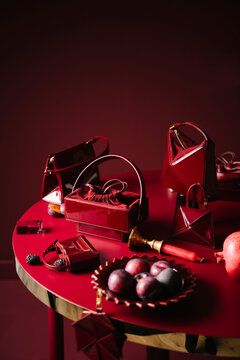 Red Luxury Handbags And Still Life Styling