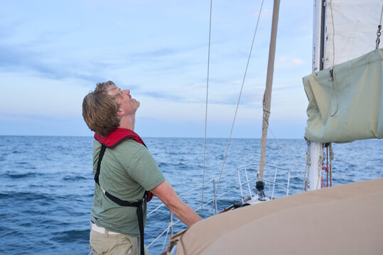 Man checking main sail