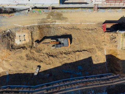 Aerial View Of Excavator Working At Construction Foundation Pit