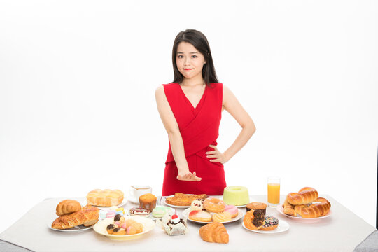 Woman Resisting Temptation of Sweets and Pastries