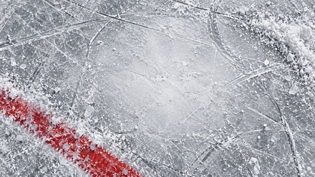 Scratched ice rink surface with deep skate marks and crushed ice shavings, a cold textured background for winter sports and athletic banners