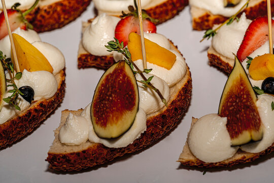 &bull; Oktoberfest catering buffet with traditional Bavarian canap&eacute;s, mini pretzel sandwiches, obatzda bites, and rustic finger food snacks.