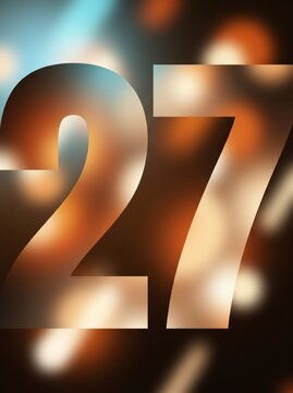 Warm amber and champagne bokeh filling bold New Year number 27 on dark chocolate brown background