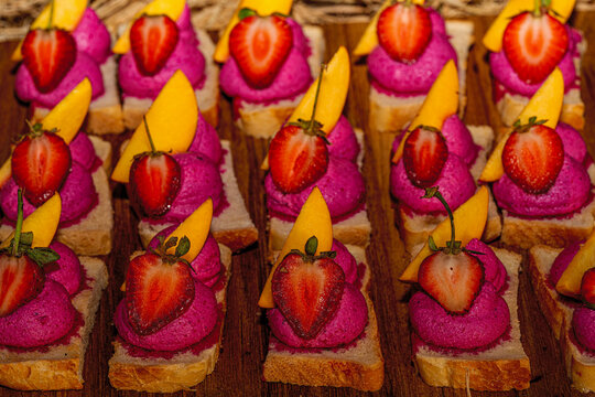 &bull; Oktoberfest catering buffet with traditional Bavarian canap&eacute;s, mini pretzel sandwiches, obatzda bites, and rustic finger food snacks.