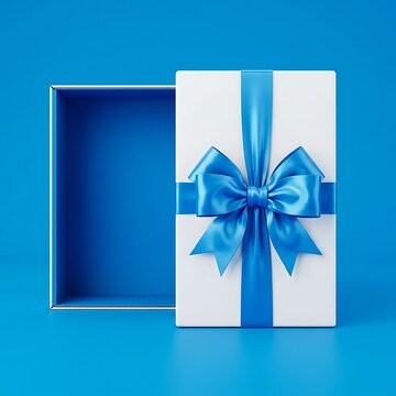 Elegant white gift box decorated with vibrant blue ribbon and bow sitting open against matching studio background showcasing luxury holiday presentation style