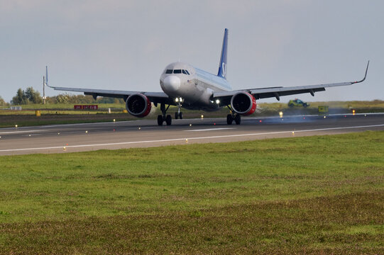 Scandinavian Airlines SAS Airbus A320 landing on airport runway with wheel smoke touchdown, Gdansk Airport, Gdansk, Poland, September 2026