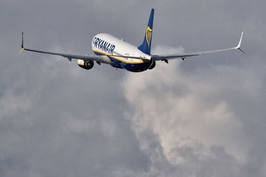 Ryanair Boeing 737 passenger airplane taking off into stormy cloudy sky in Gdansk, Poland