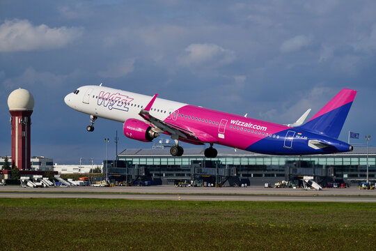 Wizz Air Airbus A321 HA-LZK taking off past radar control tower and terminal building at Gdansk Airport, Gdansk, Poland, September 2026