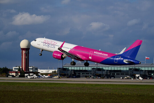 Wizz Air Airbus A321 HA-LZK climbing into the sky during takeoff near airport radar tower, Gdansk Airport, Gdansk, Poland, September 2026