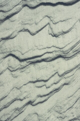 Abstract natural background of wave shaped snow dunes © Gherzak