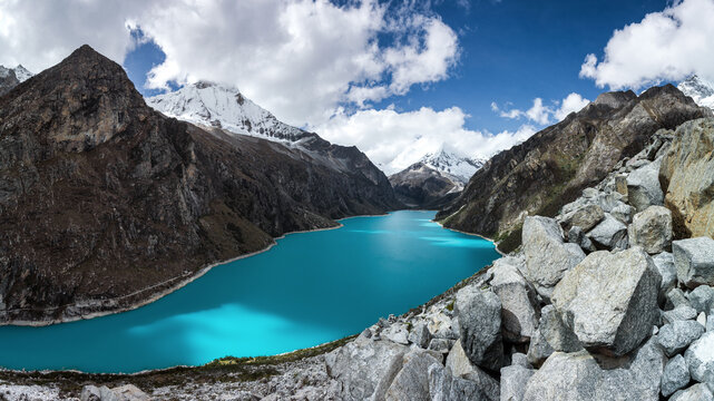 Panoramic view of turquoise Laguna Paron surrounded by snow-capped Andes in Huascaran National Park, Peru