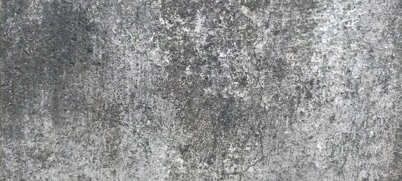 Concrete texture background with weathered rough surface, dark spots, and fine cracks, ideal for industrial design, architectural rendering, and grunge backdrops