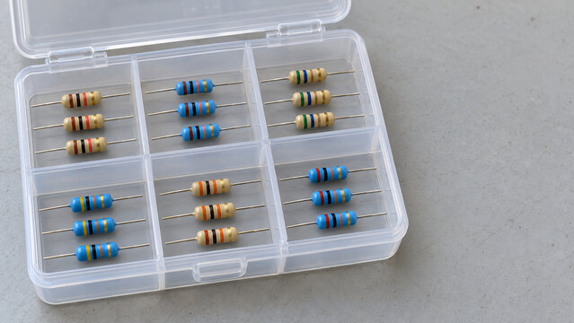 Axial resistors sorted in a clear compartment organizer