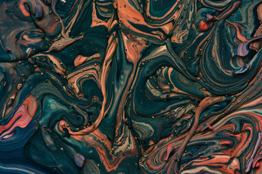 Dark abstract fluid art composition with swirls deep teal, orange, and bronze paint.