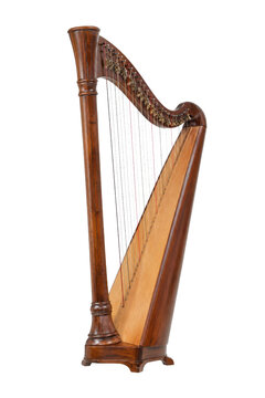 Elegant wooden pedal harp, a classical string instrument, stands upright with its intricate details and polished finish on a clean white background