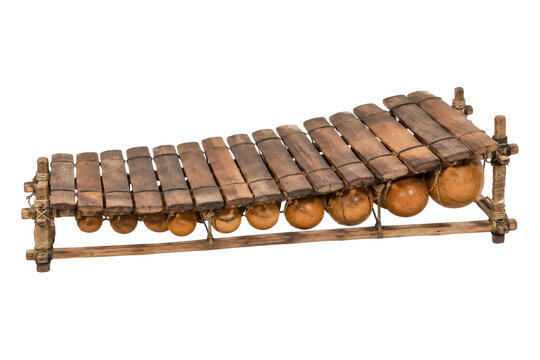 Traditional African balafon musical instrument with wooden keys and gourd resonators, shot from a high angle on a clean white background