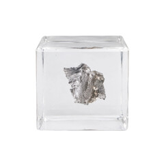Shiny silver metallic meteorite fragment is encased in a clear acrylic cube, isolated on a clean white background © no one