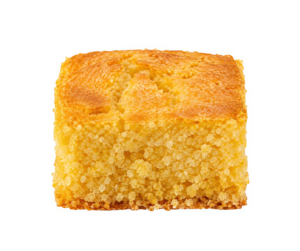 Single golden brown square piece of cornbread with a textured surface is presented on a clean white background
