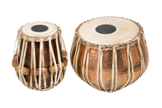 Two traditional Indian tabla drums, a bayan and a dayan, with their intricate leather lacing and wooden tuning blocks, isolated on a clean white background
