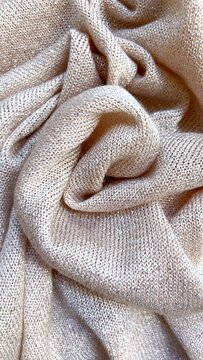 Beige Shimmering Knitted Fabric Texture Close Up