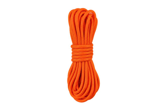 Neatly coiled bright orange paracord rope, tightly wrapped and ready for outdoor adventure on a clean white background