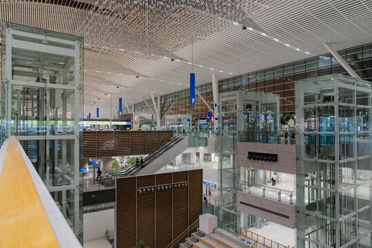 September 23, 2026, Incheon, South Korea - Interior view of Incheon International Airport Terminal 2 with escalators, glass elevators, and modern architecture