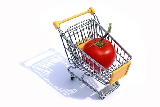 Giant tomato in a shopping cart