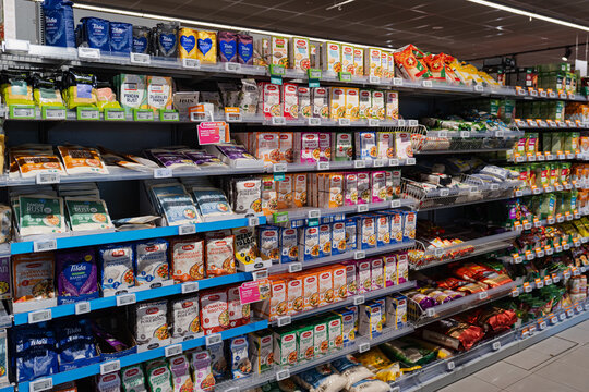 September 26, 2026, Amsterdam, Netherlands - Supermarket aisle stocked with various rice and meal kits at Albert Heijn XL