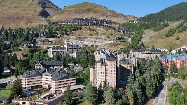 Aerial view of luxury chalets and slate-roof villas in Baqueira village during summer, Val d'Aran, Spanish Pyrenees, Spain