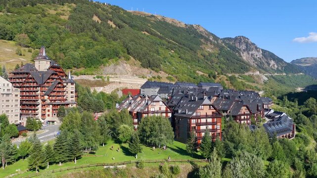 Aerial view of luxury chalets and slate-roof villas in Baqueira village during summer, Val d'Aran, Spanish Pyrenees, Spain