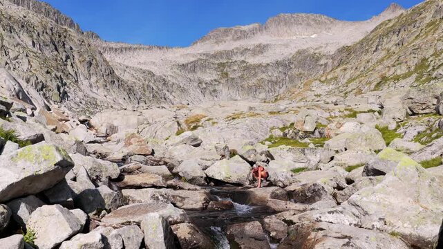 Aerial view of hikers trekking up Vall de Molieres towards Molieres peak with view of Aneto glacier, Pyrenees, Spain