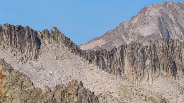 Aerial view of shrinking Monte Perdido glacier and exposed rock face due to climate change, Pyrenees, Spain