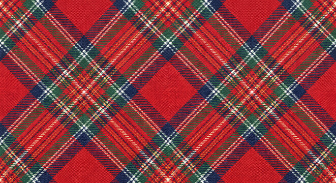 Classic red tartan plaid pattern fabric background with intersecting lines for seasonal textile design and winter holiday crafts