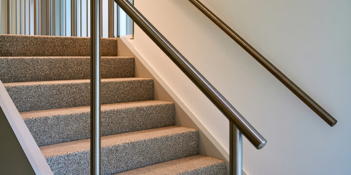 Modern Carpeted Staircase With Metal Handrails