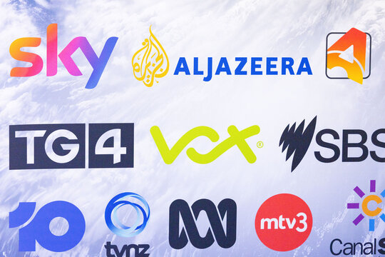 Amsterdam, Netherlands - September 11, 2026: Colorful media and television channel logos including Sky, Al Jazeera, TGA, V, SBS, MTV3 and Canal on a bright background IBC