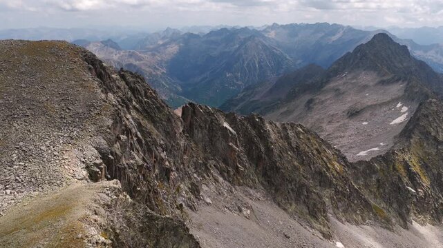 Aerial view of shrinking Monte Perdido glacier and exposed rock face due to climate change, Pyrenees, Spain