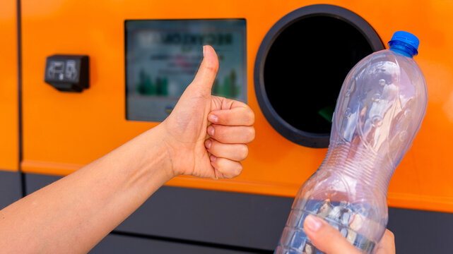 Bottle recycling concept with woman near return station.
