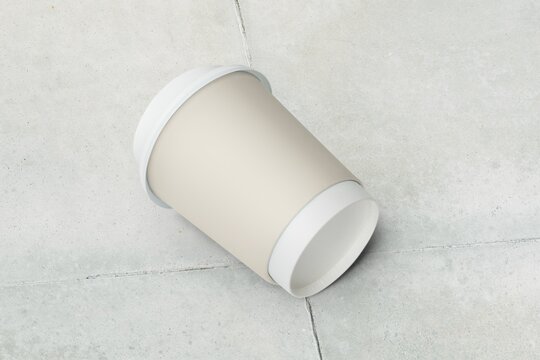 Blank paper cup on the ground