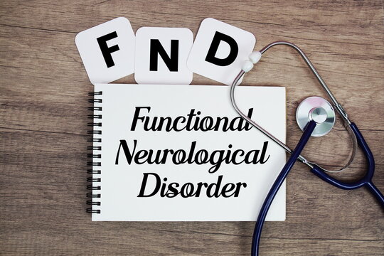 FND Functional Neurological Disorder text written on notepad with stethoscope on wooden background