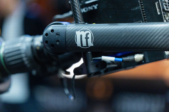 Amsterdam, Netherlands - September 11, 2026: Close view of a broadcast camera microphone with carbon fiber housing, cables, and visible RDE branding at IBC media technology event