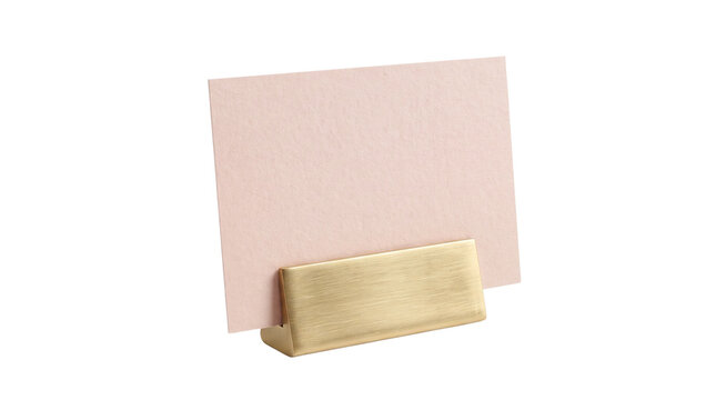 Modern brass card holder with blank pink place card, elegant metallic business card mockup, minimalist table seating card display isolated PNG with Transparent Background