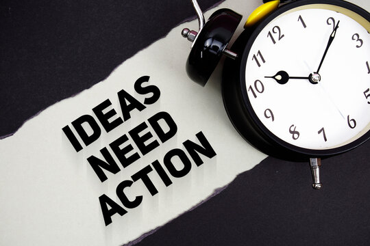 Ideas Need Action with alarm clock on gray background