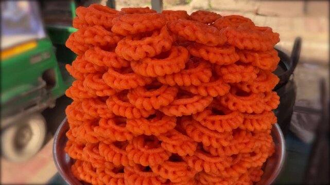 Fresh delicious indian imarti sweet displayed at street food stall 4k video footage