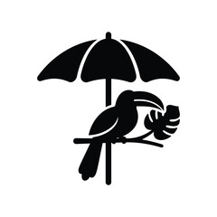 Fototapeta premium Toucan bird sitting on branch under tropical sun umbrella.