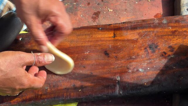 Indian chef rolling dough for chapati